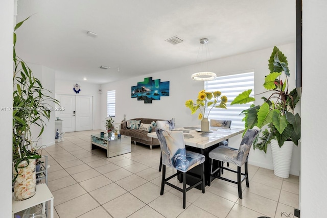 dining room featuring light tile patterned flooring and a wealth of natural light