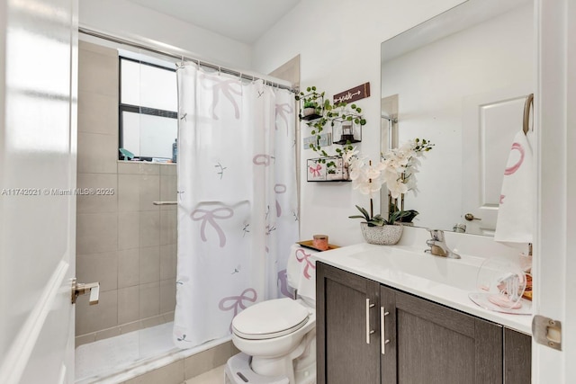 bathroom with walk in shower, vanity, and toilet