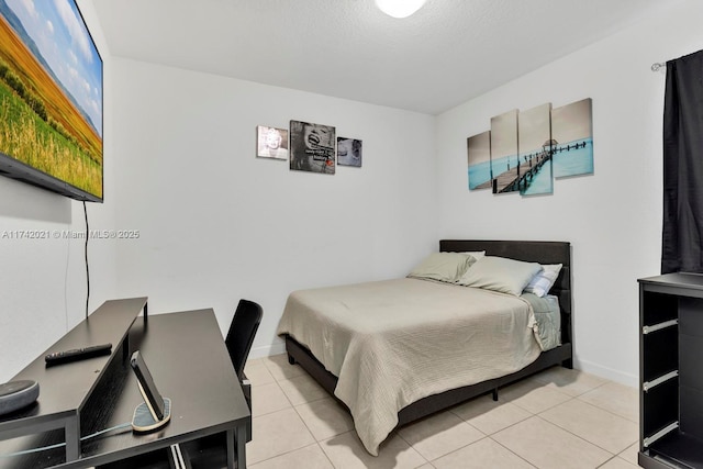 bedroom featuring light tile patterned floors