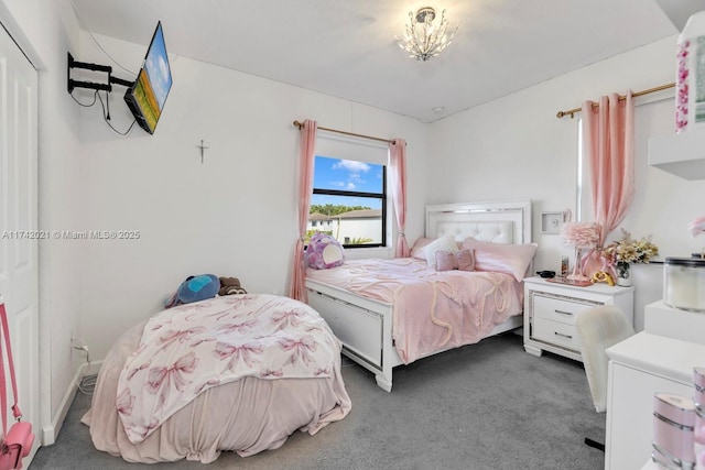 bedroom featuring dark carpet