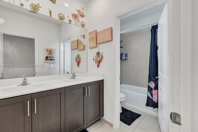 full bathroom featuring tile patterned flooring, vanity, shower / tub combo, and toilet