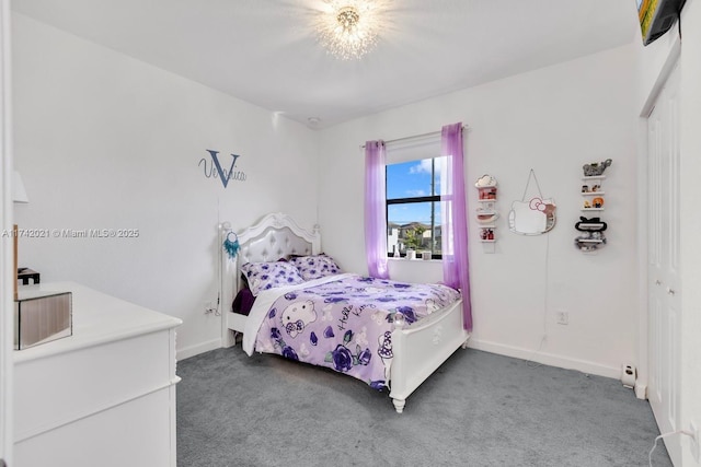 carpeted bedroom featuring a closet