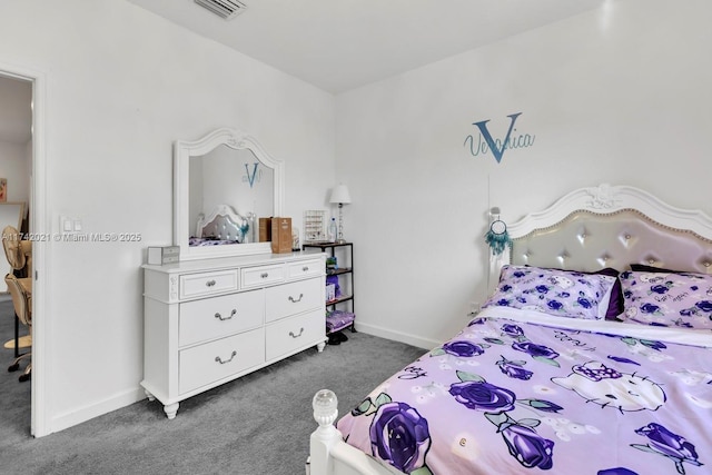 bedroom with dark colored carpet