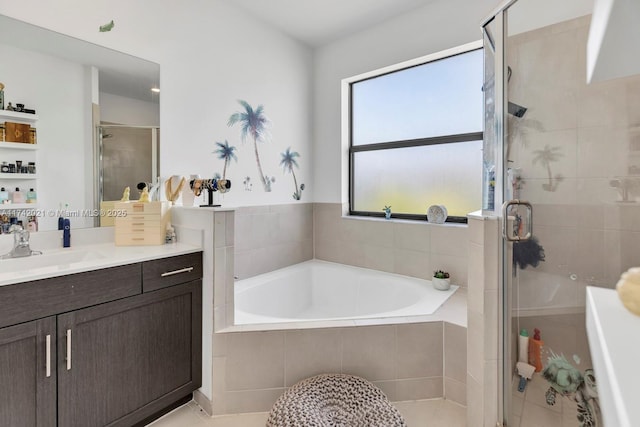 bathroom featuring vanity and shower with separate bathtub