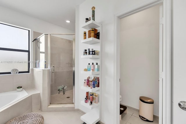 bathroom with toilet, separate shower and tub, and tile patterned flooring