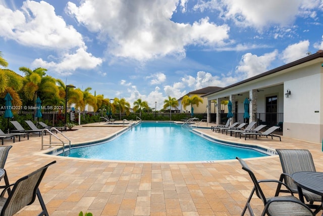 view of swimming pool featuring a patio area