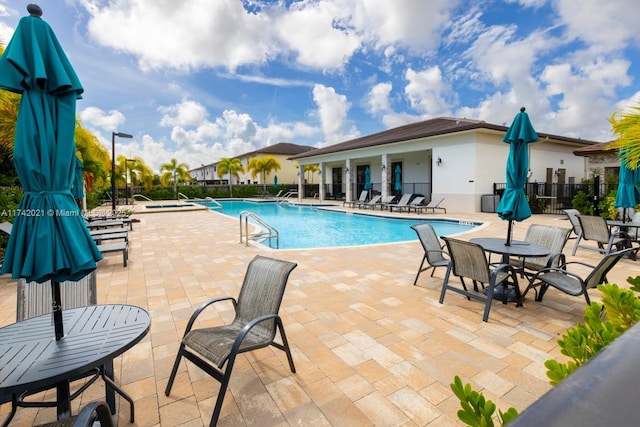 view of swimming pool featuring a patio