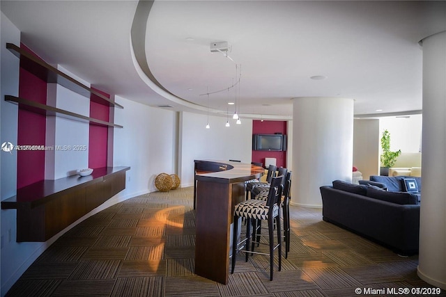 view of carpeted dining area