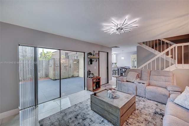 living room with an inviting chandelier and light tile patterned floors