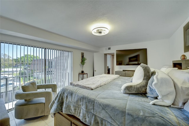 tiled bedroom featuring access to exterior