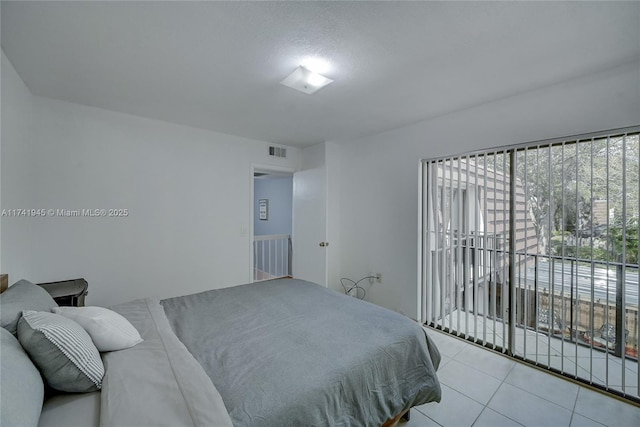 bedroom featuring light tile patterned flooring