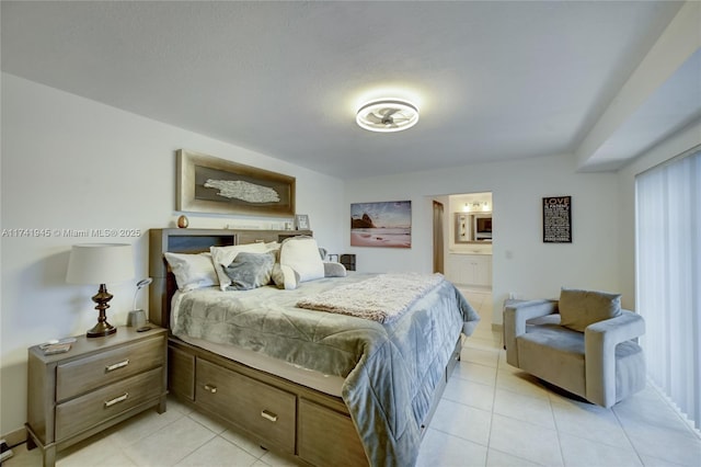 tiled bedroom featuring ensuite bathroom