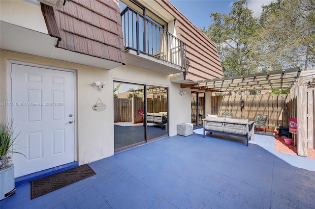 view of patio / terrace featuring an outdoor living space, a balcony, and a pergola