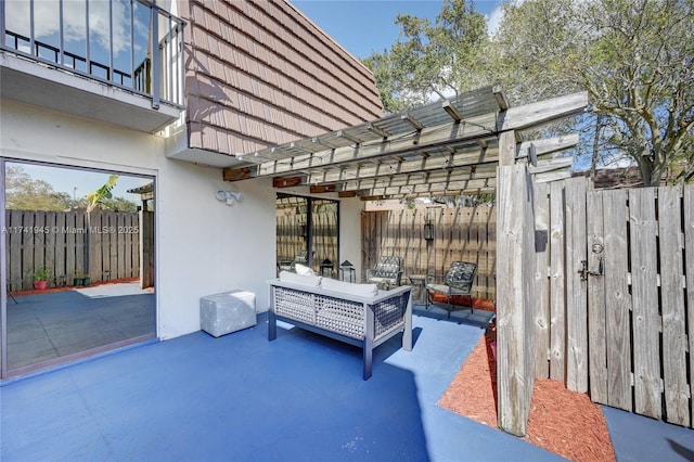 view of patio / terrace with an outdoor living space and a pergola