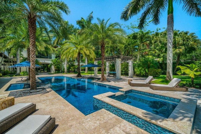 view of pool with an in ground hot tub, a pergola, and a patio