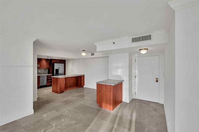 2000 Towerside Ter Unit 910, Miami, FL 33138 - kitchen featuring appliances with stainless steel finishes, light countertops, a kitchen island, a kitchen bar, and ornamental molding