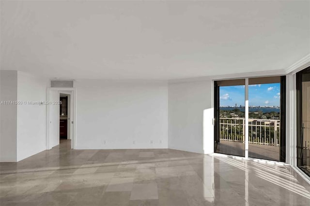 unfurnished room featuring expansive windows