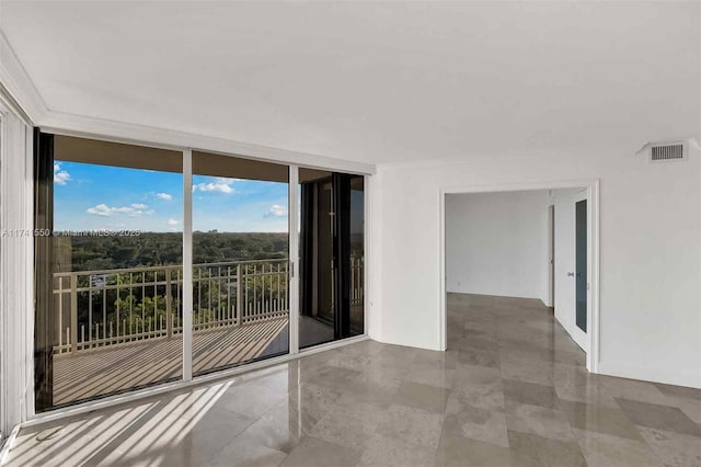 2000 Towerside Ter Unit 910, Miami, FL 33138 - unfurnished room with a wall of windows