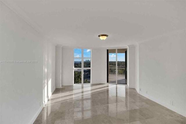 2000 Towerside Ter Unit 910, Miami, FL 33138 - unfurnished room with expansive windows and ornamental molding