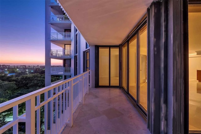 view of balcony at dusk