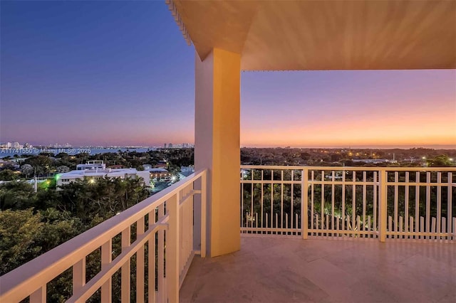 view of balcony at dusk