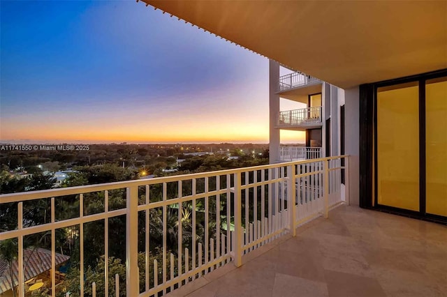 view of balcony at dusk