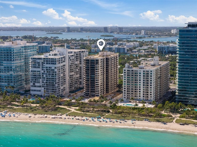 aerial view featuring a view of the beach and a water view