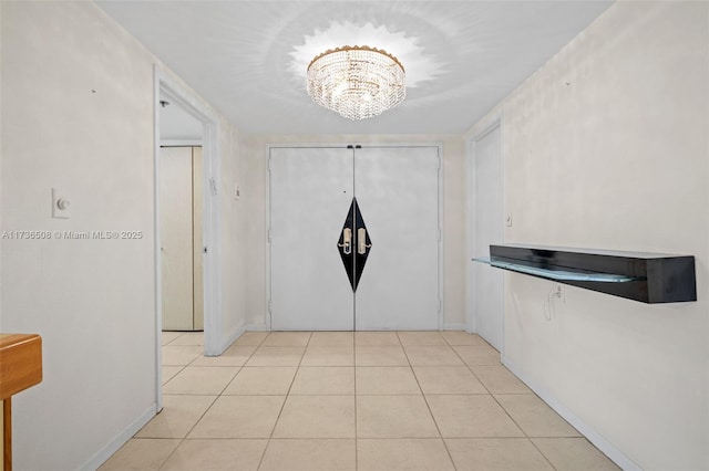 interior space with an inviting chandelier and light tile patterned flooring