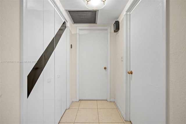 hall with light tile patterned flooring