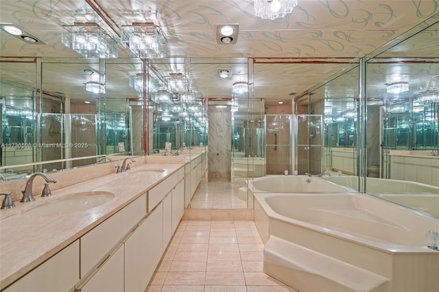 bathroom featuring vanity, independent shower and bath, and tile patterned flooring