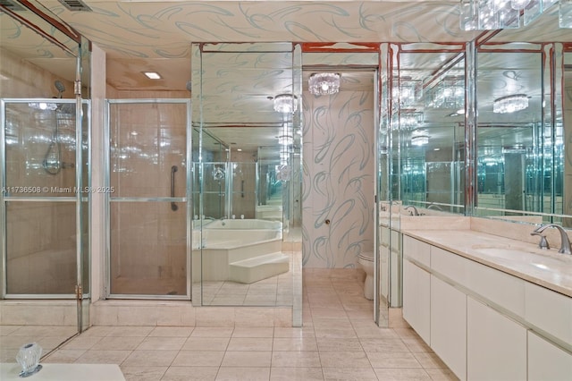 bathroom featuring tile patterned floors, toilet, an enclosed shower, and vanity