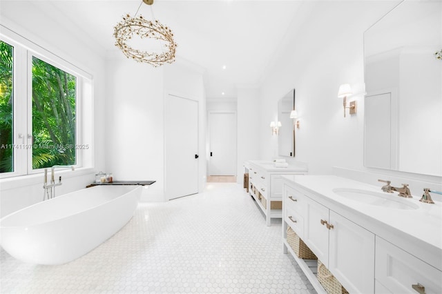 5501 Snapper Creek Rd, Coral Gables, FL 33156 - full bathroom featuring a freestanding tub, two vanities, and a sink