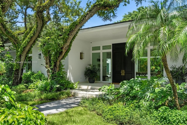 5501 Snapper Creek Rd, Coral Gables, FL 33156 - view of exterior entry featuring stucco siding