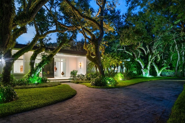 5501 Snapper Creek Rd, Coral Gables, FL 33156 - view of front of home with stucco siding and decorative driveway