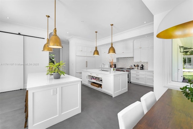 5501 Snapper Creek Rd, Coral Gables, FL 33156 - kitchen with high end stainless steel range oven, white cabinetry, a sink, a center island with sink, and backsplash