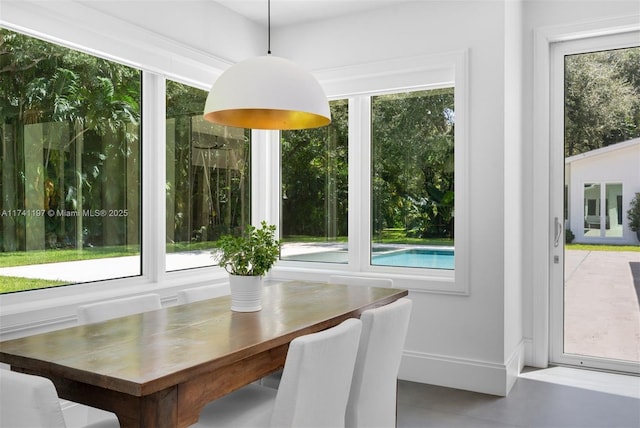 5501 Snapper Creek Rd, Coral Gables, FL 33156 - tiled dining space featuring baseboards