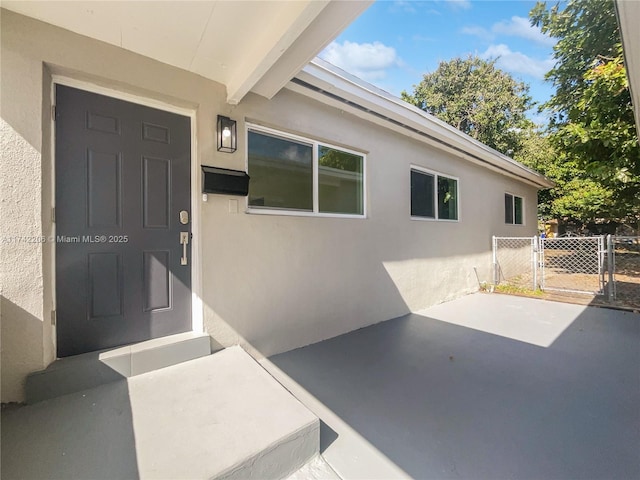 property entrance with a patio