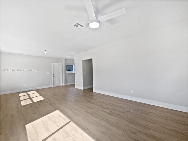 spare room with wood-type flooring and ceiling fan