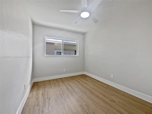 empty room with light hardwood / wood-style flooring and ceiling fan