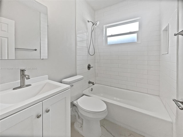 full bathroom with tiled shower / bath, vanity, and toilet