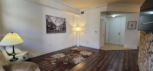 interior space with hardwood / wood-style flooring and ornamental molding