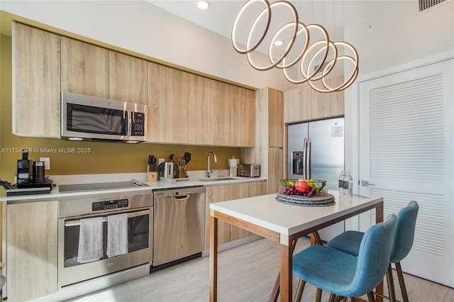 3900 Biscayne Blvd Unit N-823, Miami, FL 33137 - kitchen featuring light brown cabinetry, appliances with stainless steel finishes, modern cabinets, a sink, and light countertops
