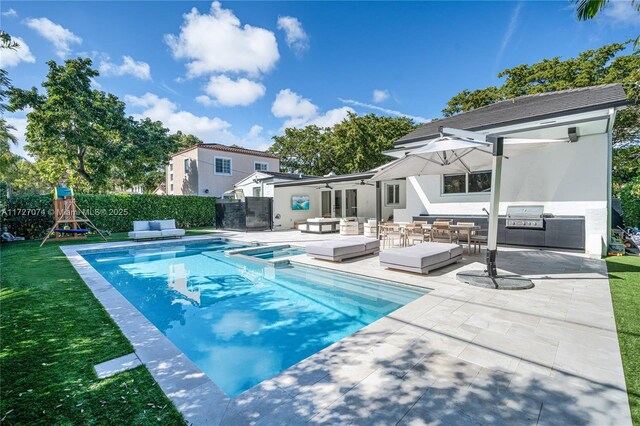 view of swimming pool featuring grilling area, area for grilling, an in ground hot tub, a playground, and a patio