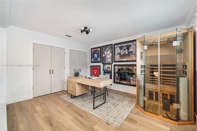 office area featuring wood finished floors, visible vents, baseboards, a sauna, and crown molding