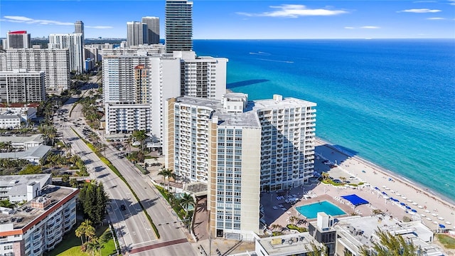 bird's eye view with a water view and a view of the beach