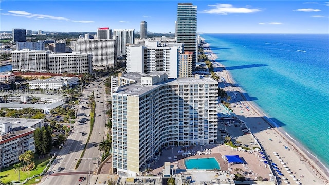 birds eye view of property featuring a view of the beach and a water view