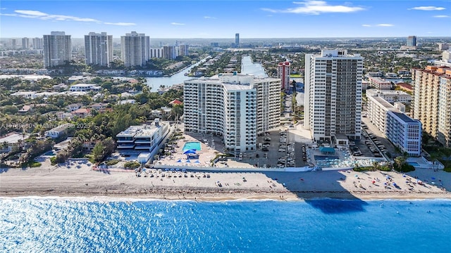 bird's eye view featuring a water view and a view of the beach