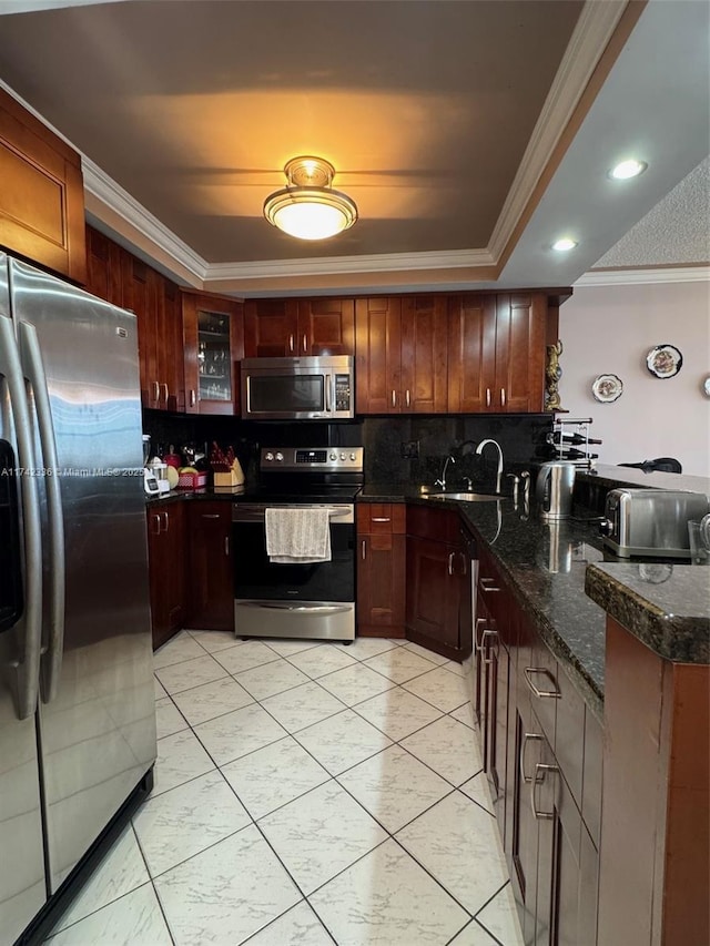 kitchen featuring appliances with stainless steel finishes, tasteful backsplash, sink, dark stone countertops, and crown molding