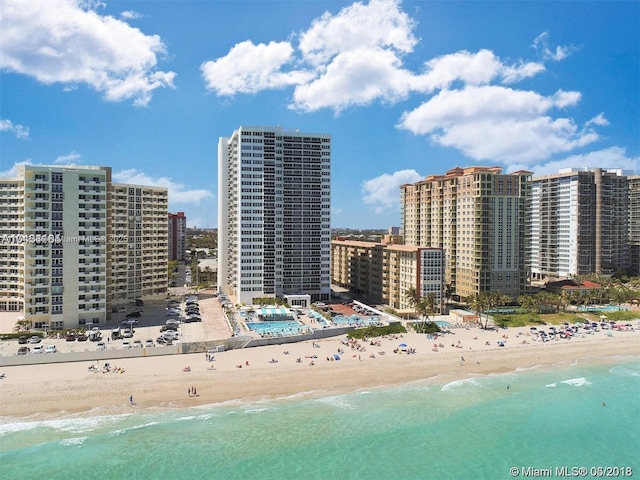 exterior space featuring a beach view and a water view