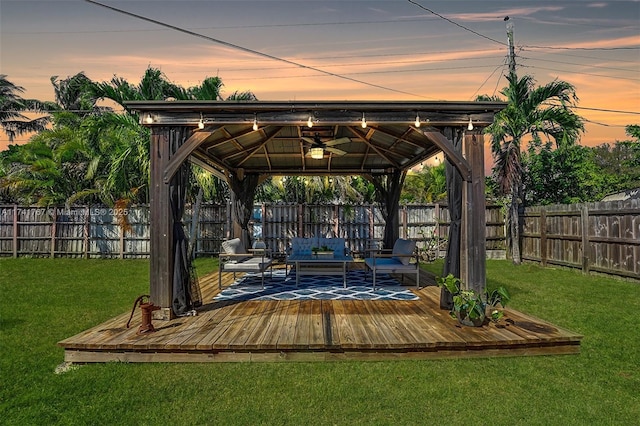 view of home's community with a gazebo, an outdoor hangout area, a lawn, and a deck